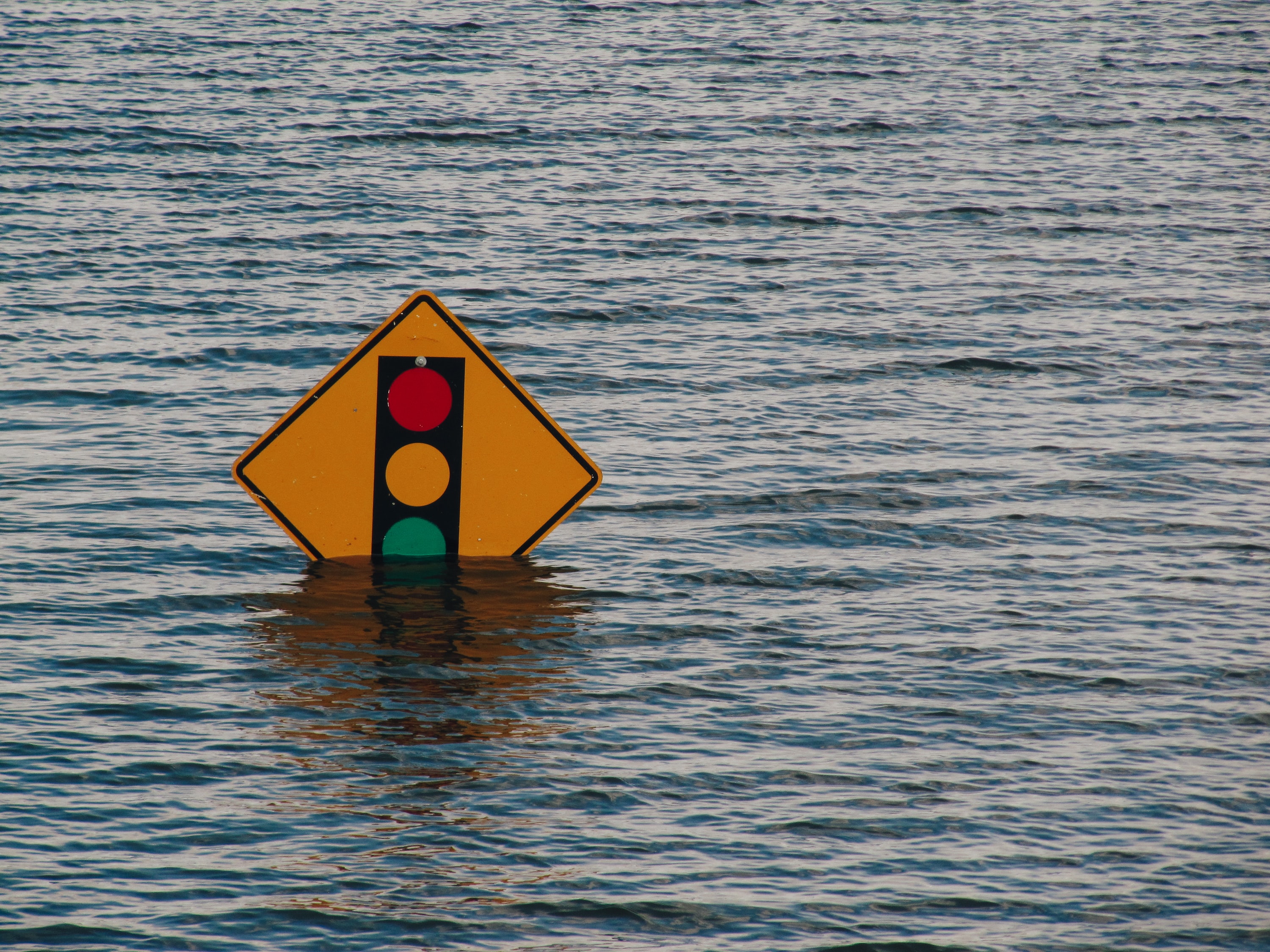 flooded street with a sign